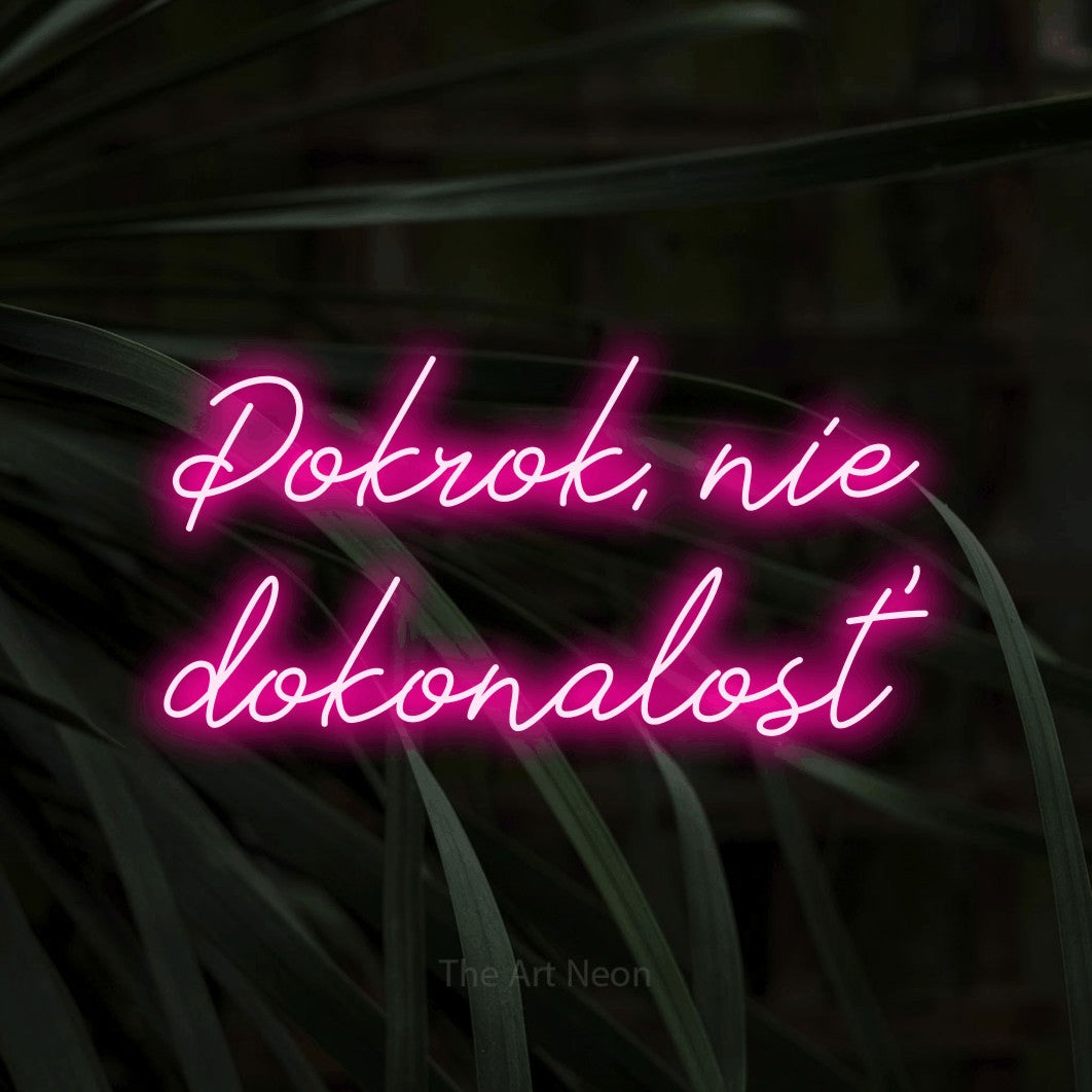 LED neon sign reading “Pokrok, nie dokonalosť”, arranged in two lines.