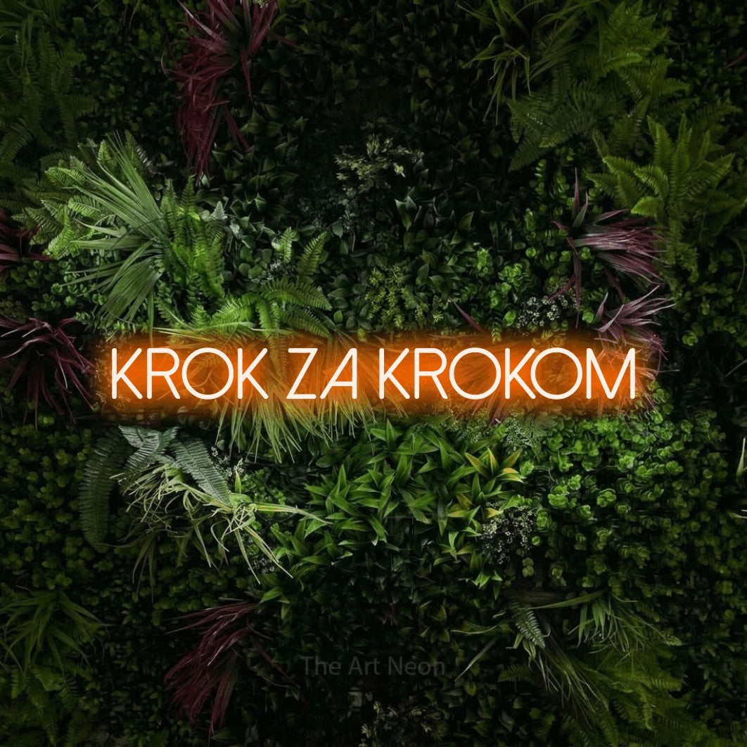 LED neon sign reading “Krok za krokom”, arranged in a single line.