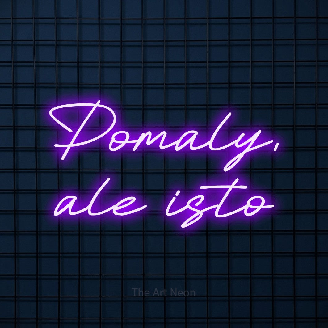 LED neon sign reading “Pomaly, ale isto”, arranged in two lines.