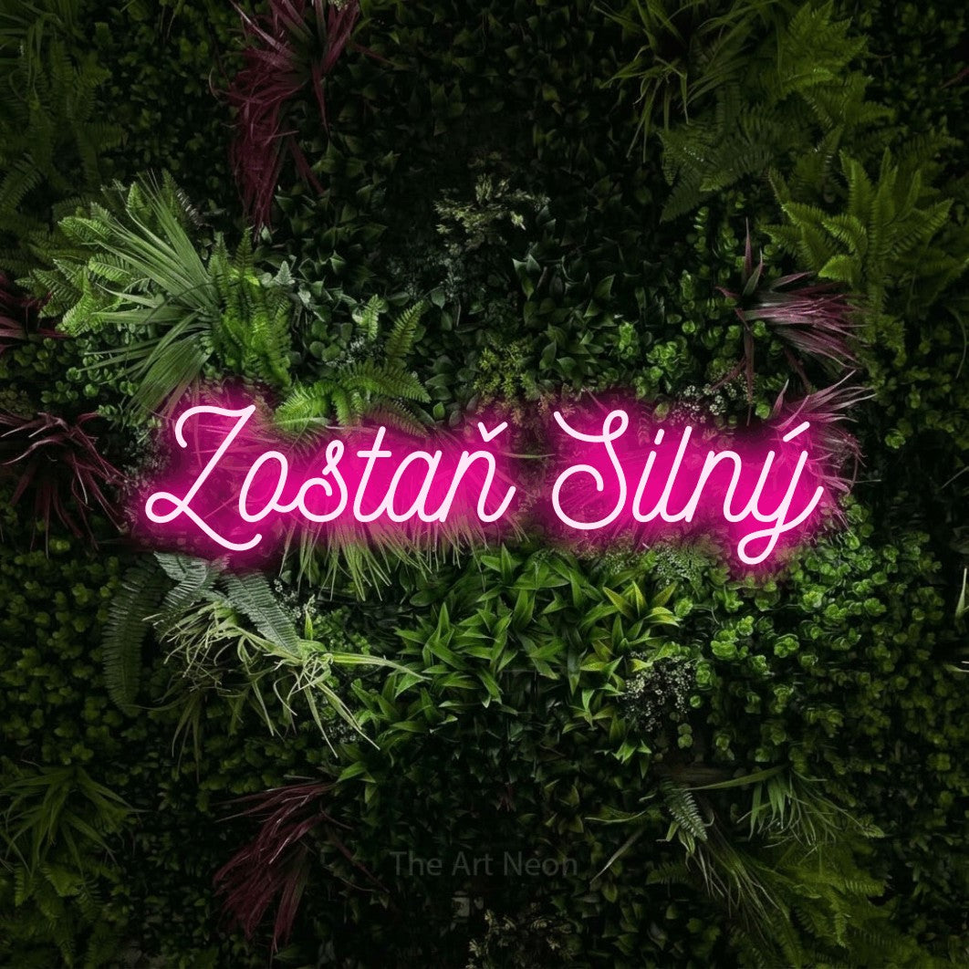 LED neon sign reading “Zostaň Silný”, arranged in a single line.