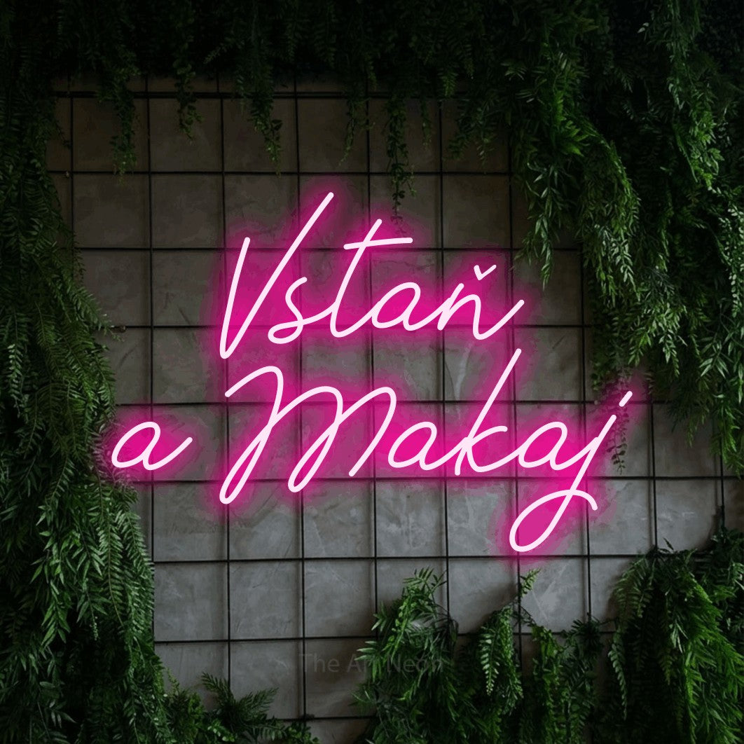 LED neon sign reading “Vstaň a Makaj”, arranged in two lines.