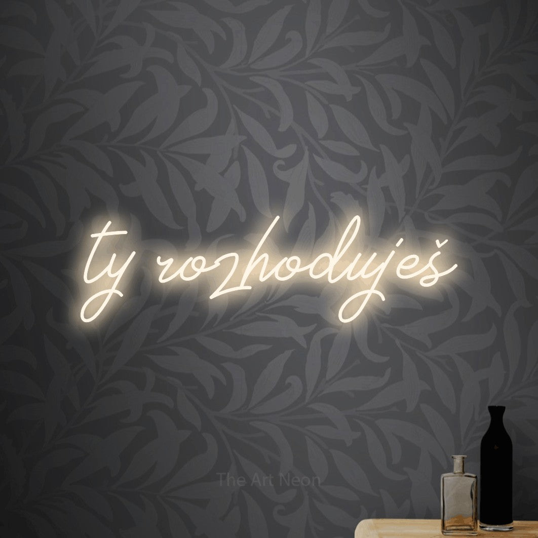 LED neon sign reading “ty rozhoduješ”, arranged in a single line.