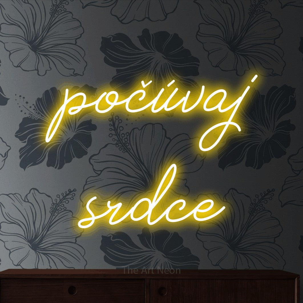 LED neon sign reading “počúvaj srdce”, arranged in two lines.