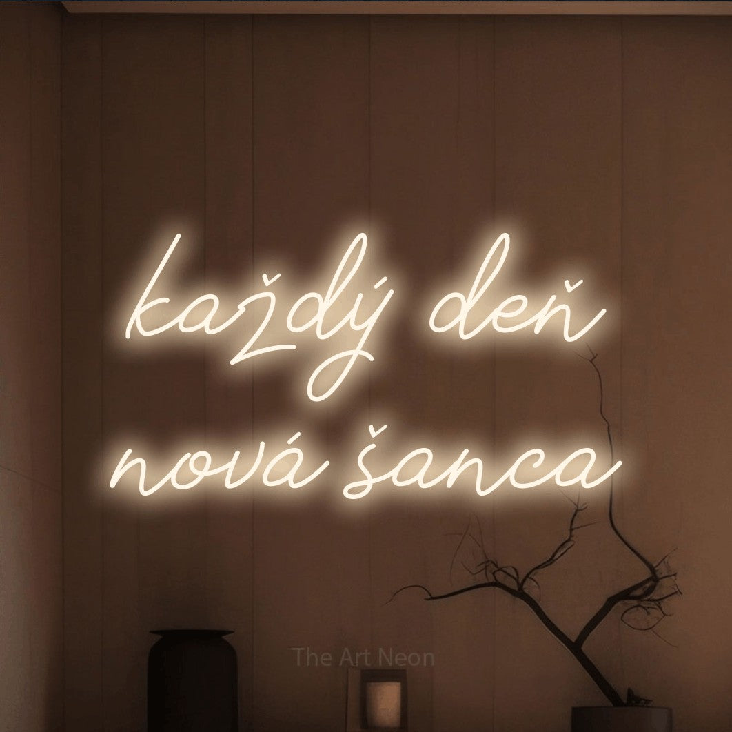 LED neon sign reading “každý deň nová šanca”, arranged in two lines.