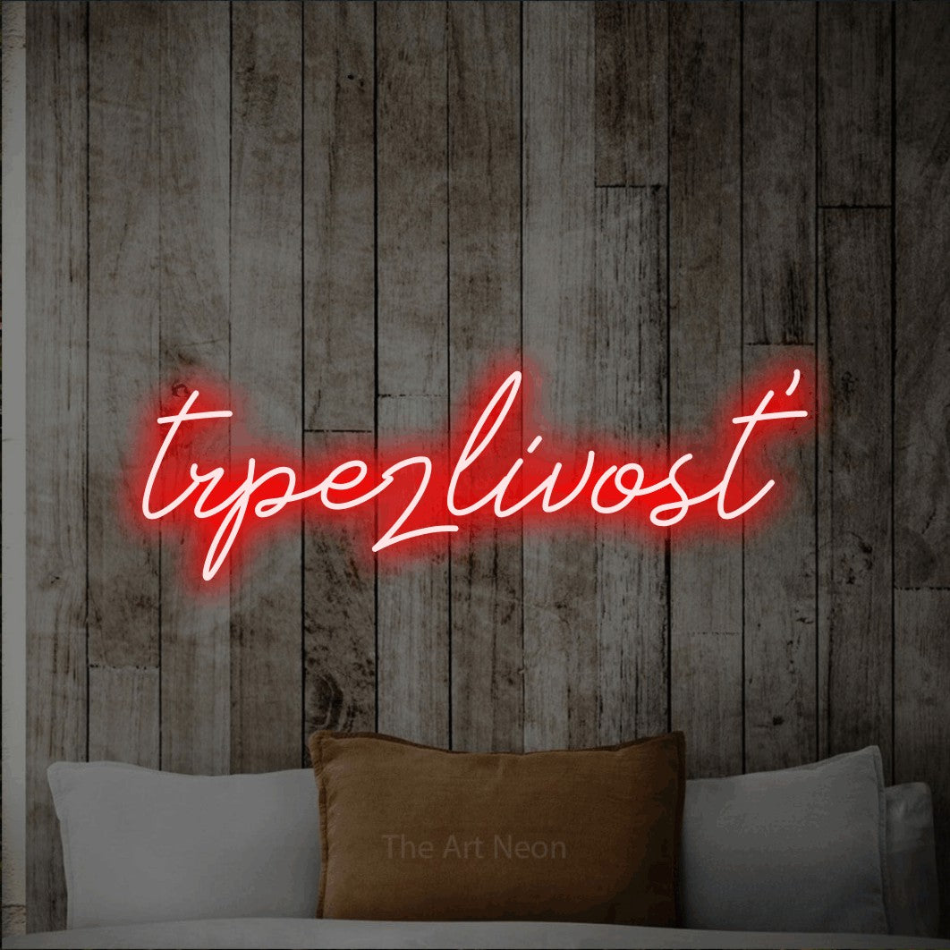 LED neon sign reading “trpezlivosť”, arranged in a single line.