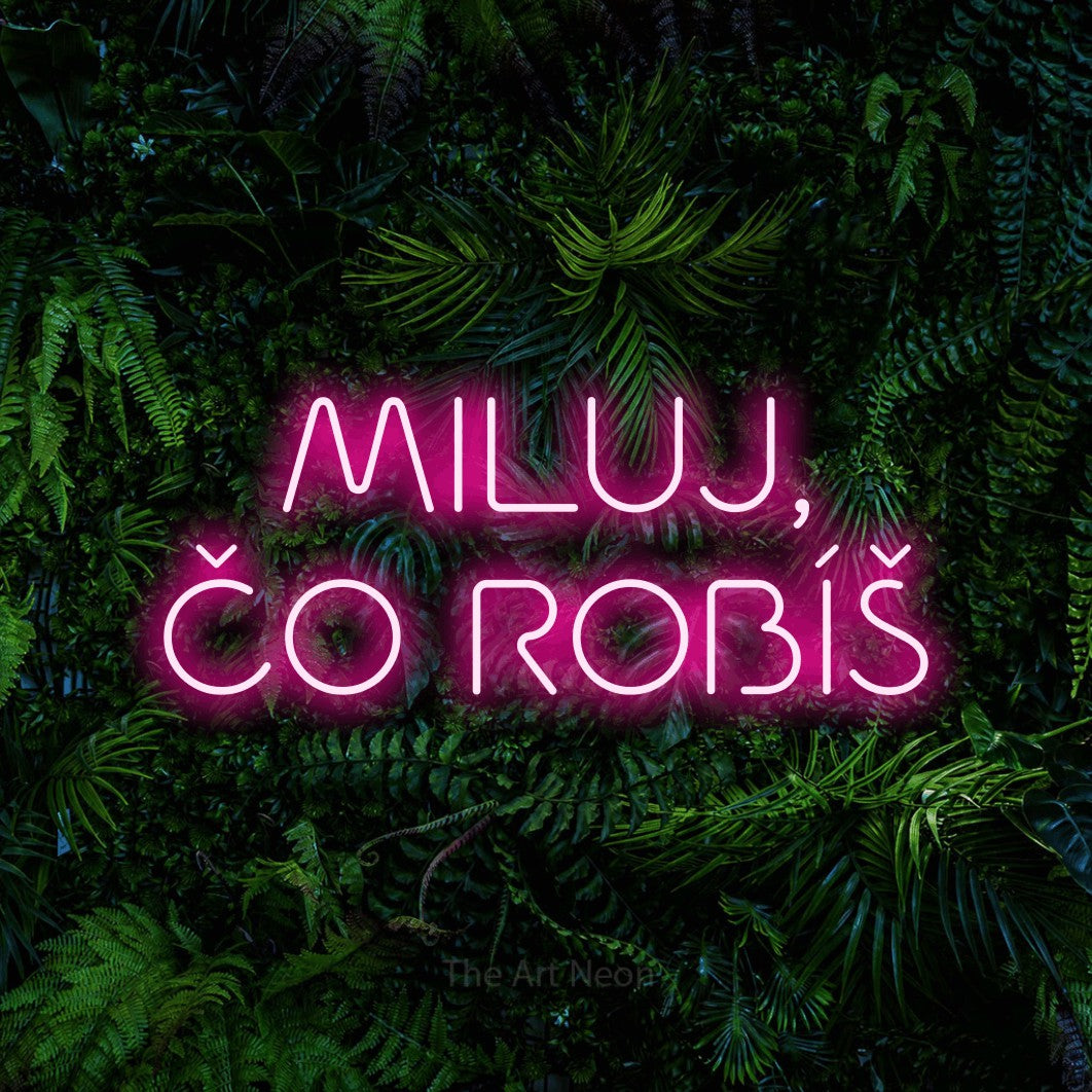 LED neon sign reading “MILUJ, ČO ROBÍŠ”, arranged in two lines.