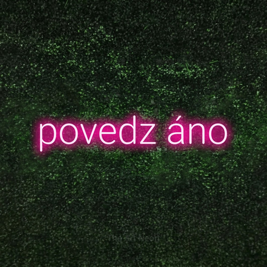 LED neon sign reading “povedz áno”, arranged in a single line.