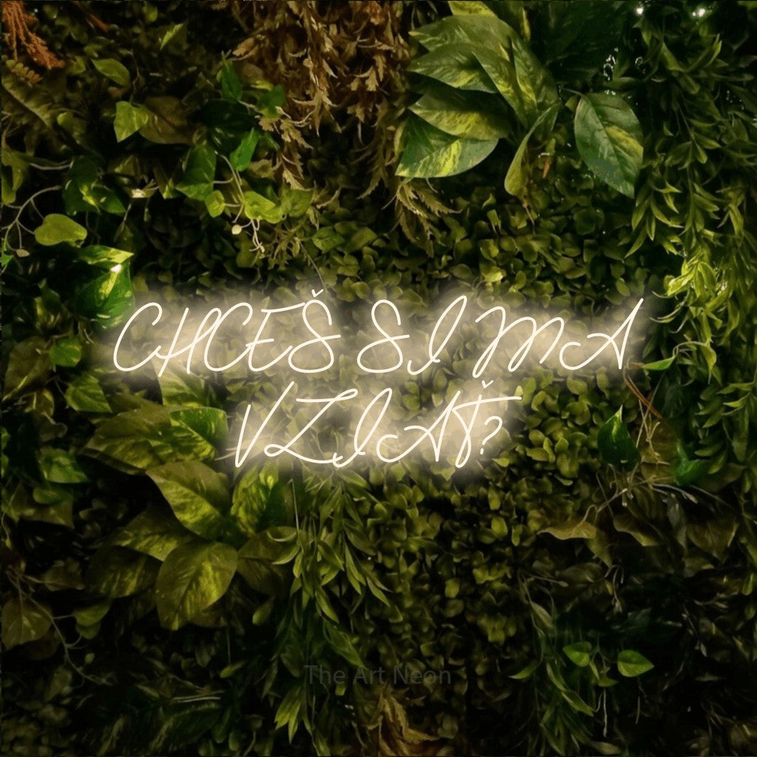 LED neon sign reading “CHCEŠ SI MA VZIAŤ?”, arranged in two lines.