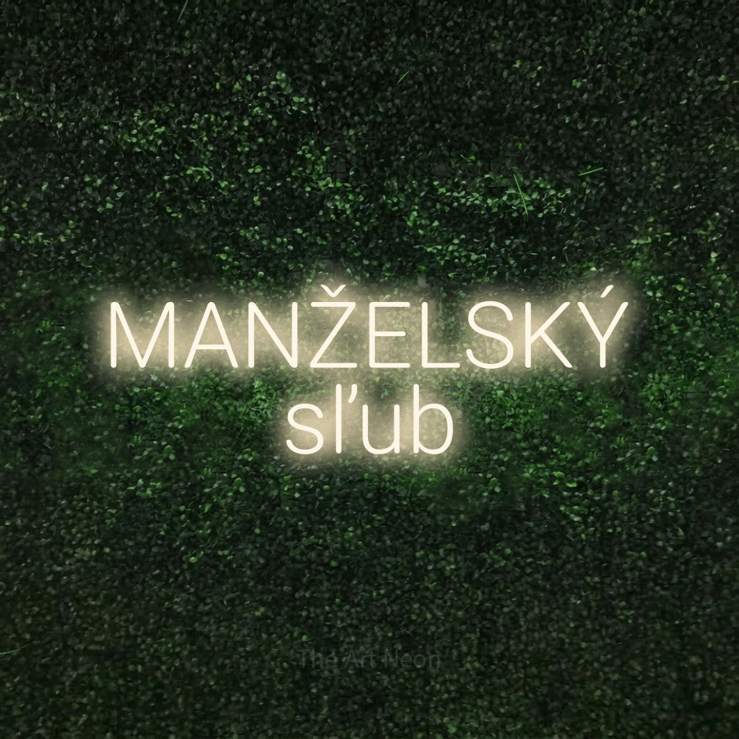 LED neon sign reading “MANŽELSKÝ sľub”, arranged in two lines.
