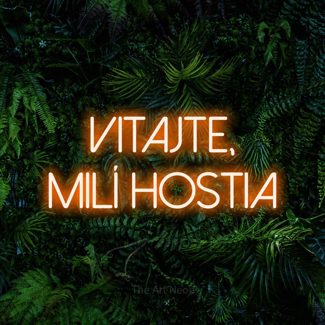 LED neon sign reading “Vitajte, milí hostia”, arranged in two lines.