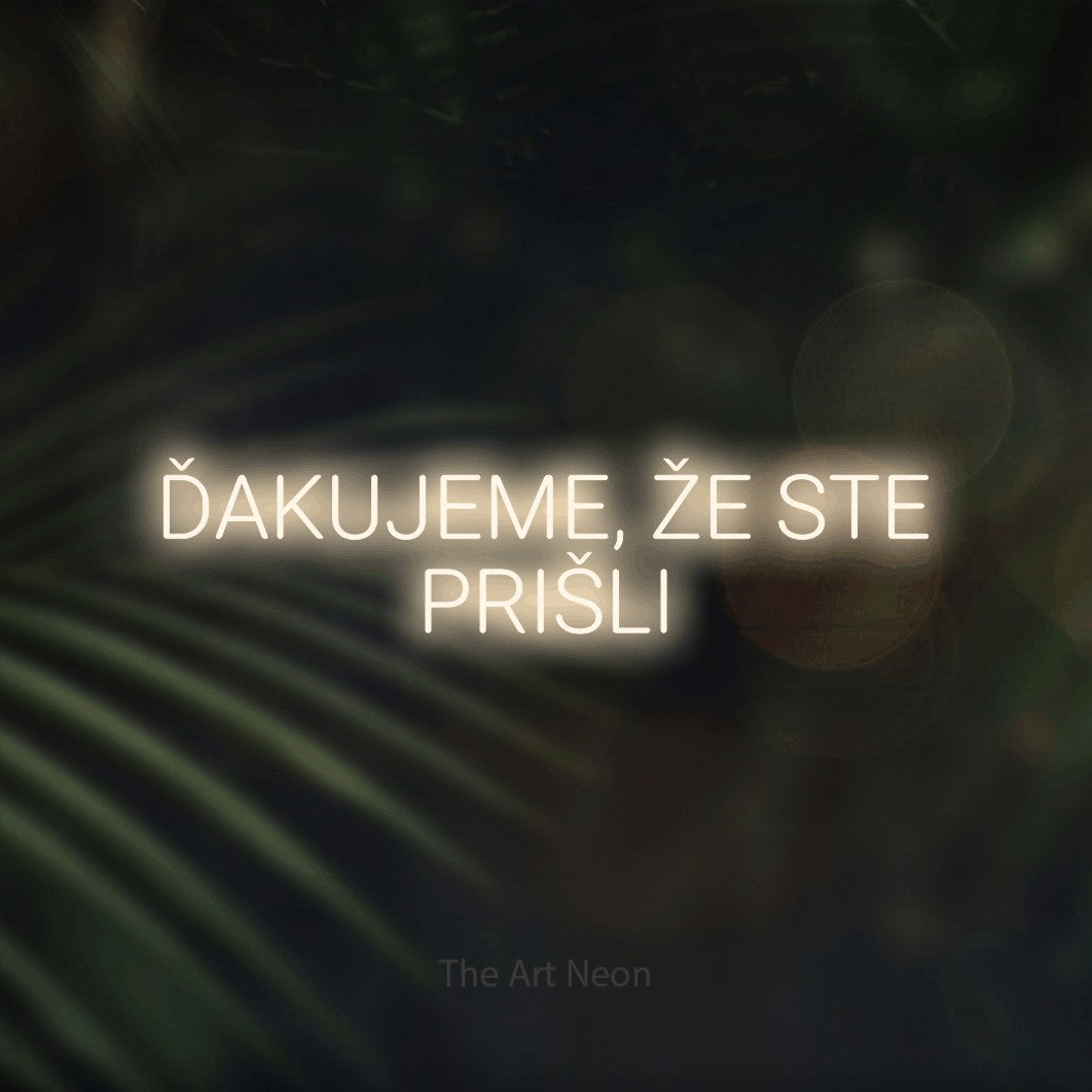 LED neon sign reading “ĎAKUJEME, ŽE STE PRIŠLI”, arranged in two lines.
