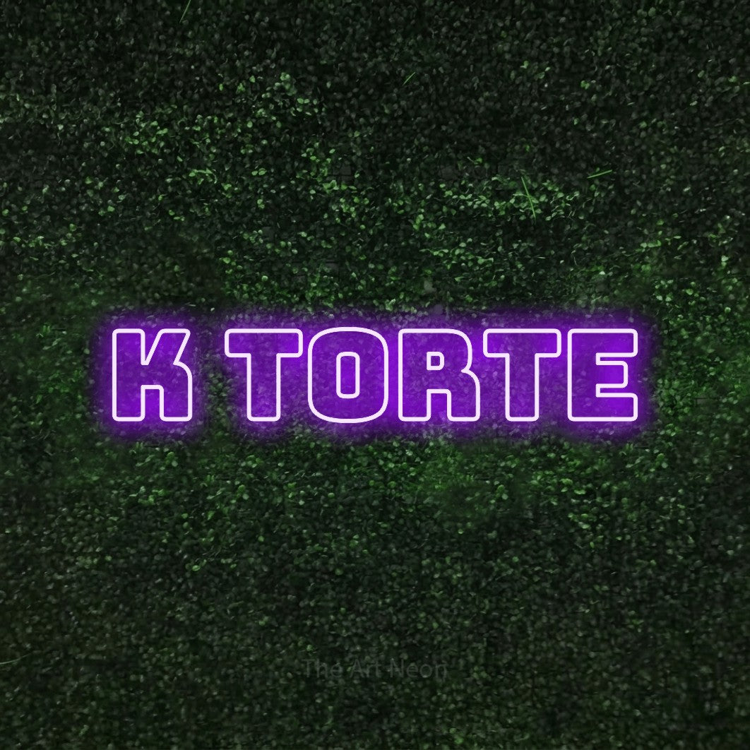 LED neon sign reading “k torte”, arranged in a single line.