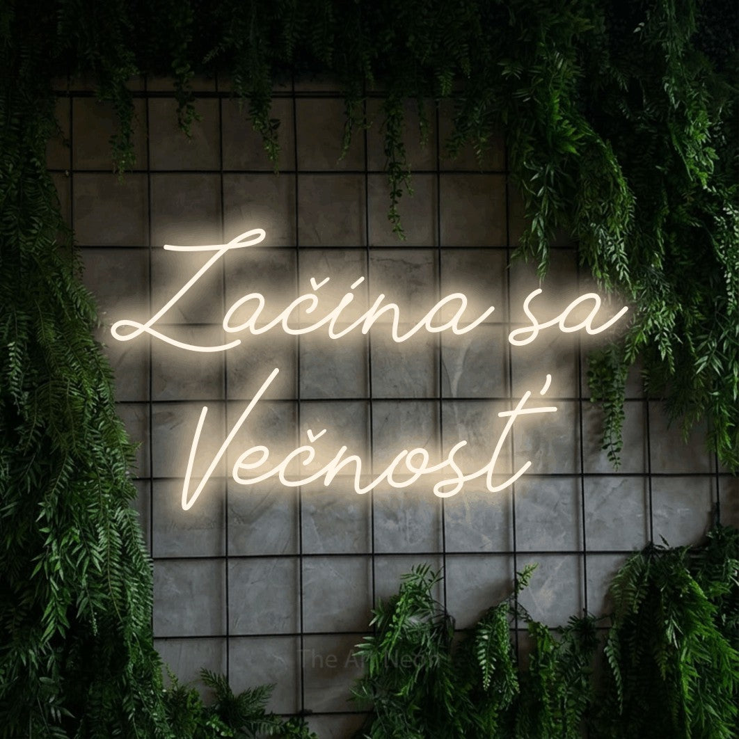 LED neon sign reading “Začína sa Večnosť”, arranged in two lines.