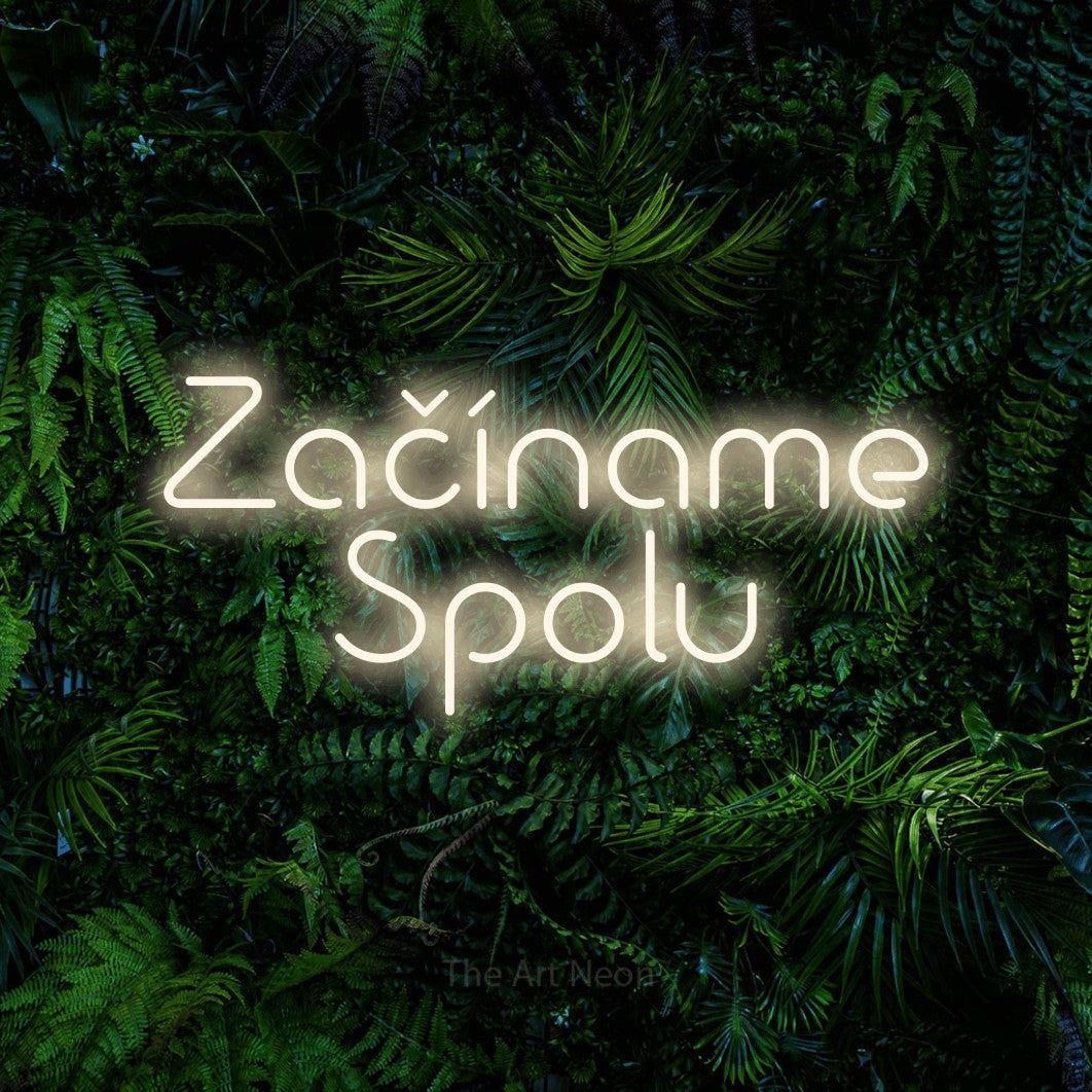 LED neon sign reading “Začíname Spolu”, arranged in two lines.