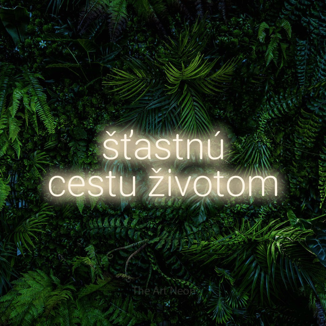 LED neon sign reading “šťastnú cestu životom”, arranged in two lines.