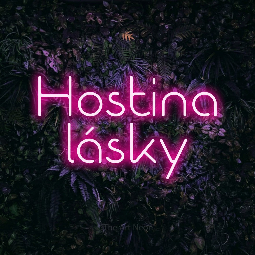 LED neon sign reading “Hostina lásky”, arranged in two lines.