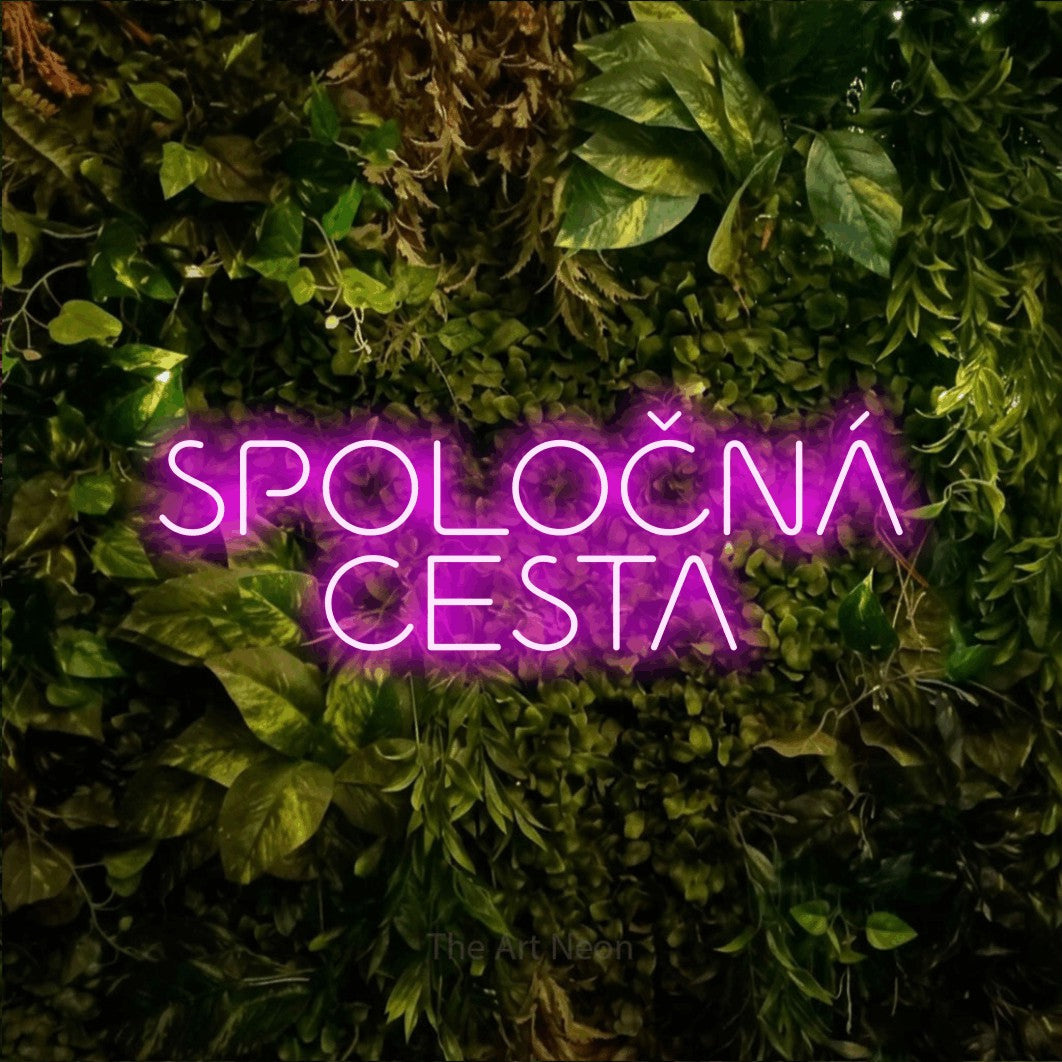 LED neon sign reading “SPOLOČNÁ CESTA”, arranged in two lines.