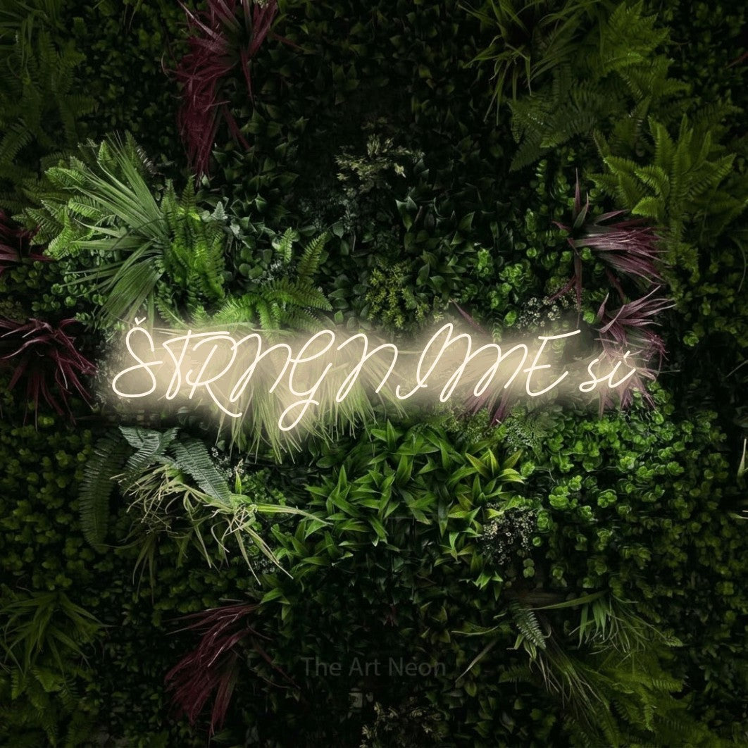LED neon sign reading “ŠTRNGNIME si”, arranged in a single line.