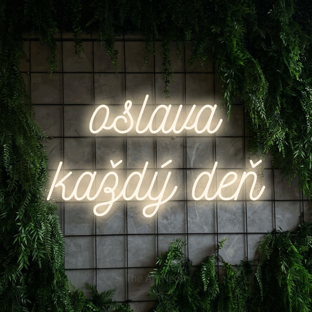 LED neon sign reading “oslava každý deň”, arranged in two lines.