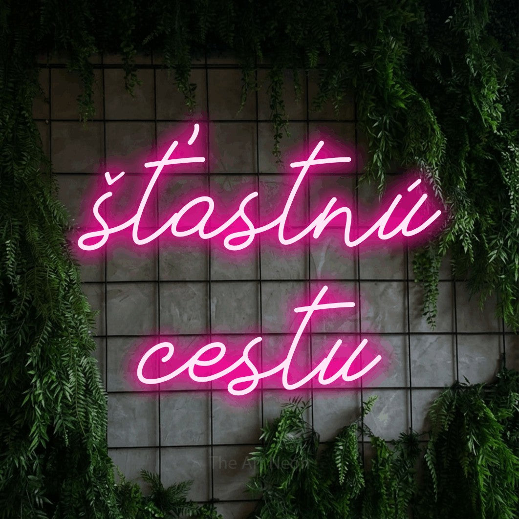 LED neon sign reading “šťastnú cestu”, arranged in two lines.