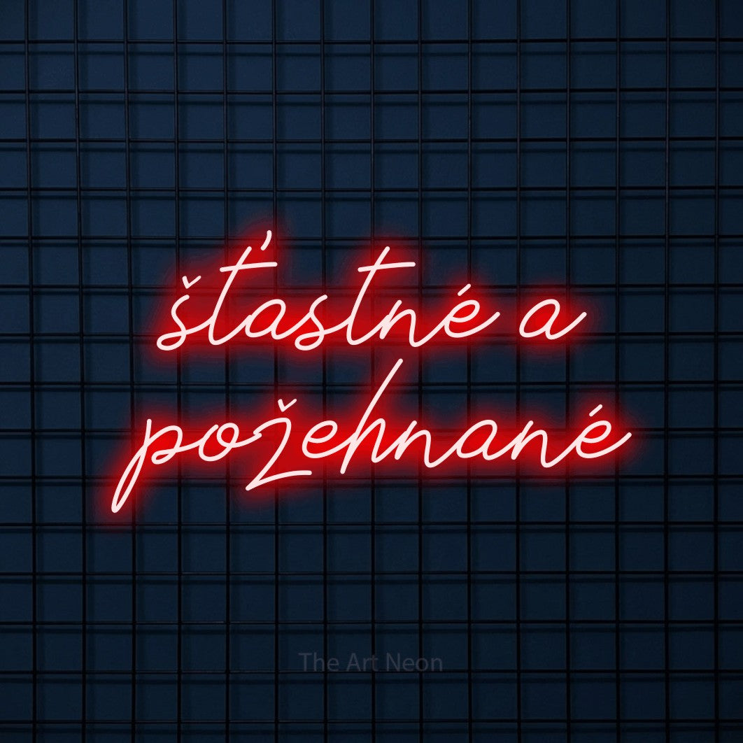 LED neon sign reading “šťastné a požehnané”, arranged in two lines.