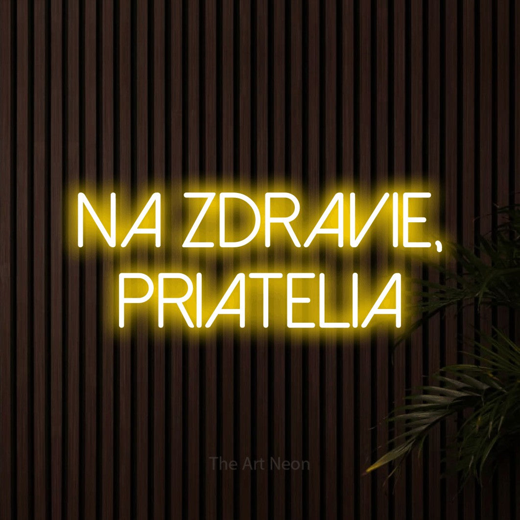 LED neon sign reading “na zdravie, priatelia”, arranged in two lines.