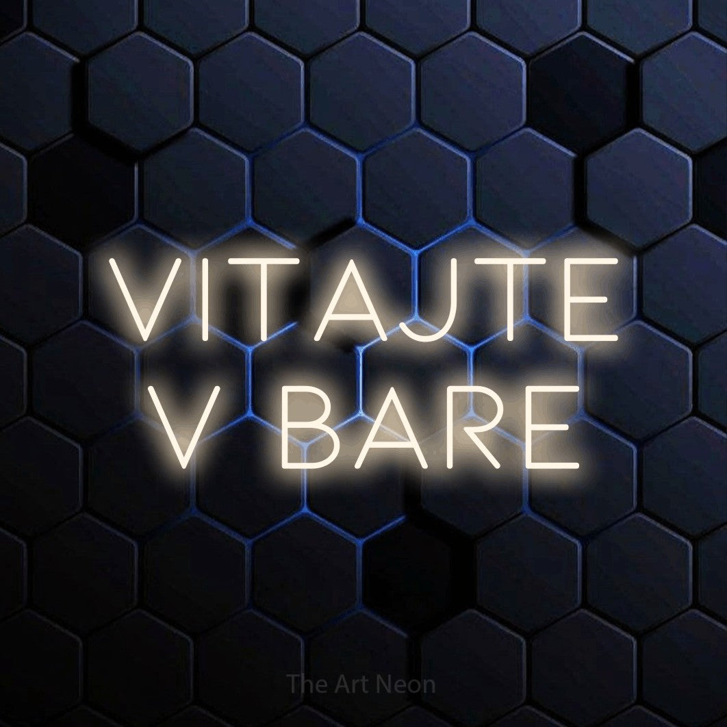 LED neon sign reading “VITAJTE V BARE”, arranged in two lines.