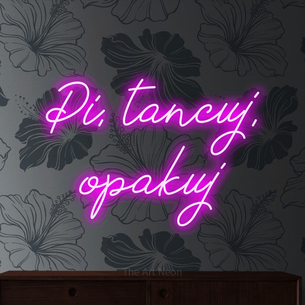 LED neon sign reading “Pi, tancuj, opakuj”, arranged in two lines.