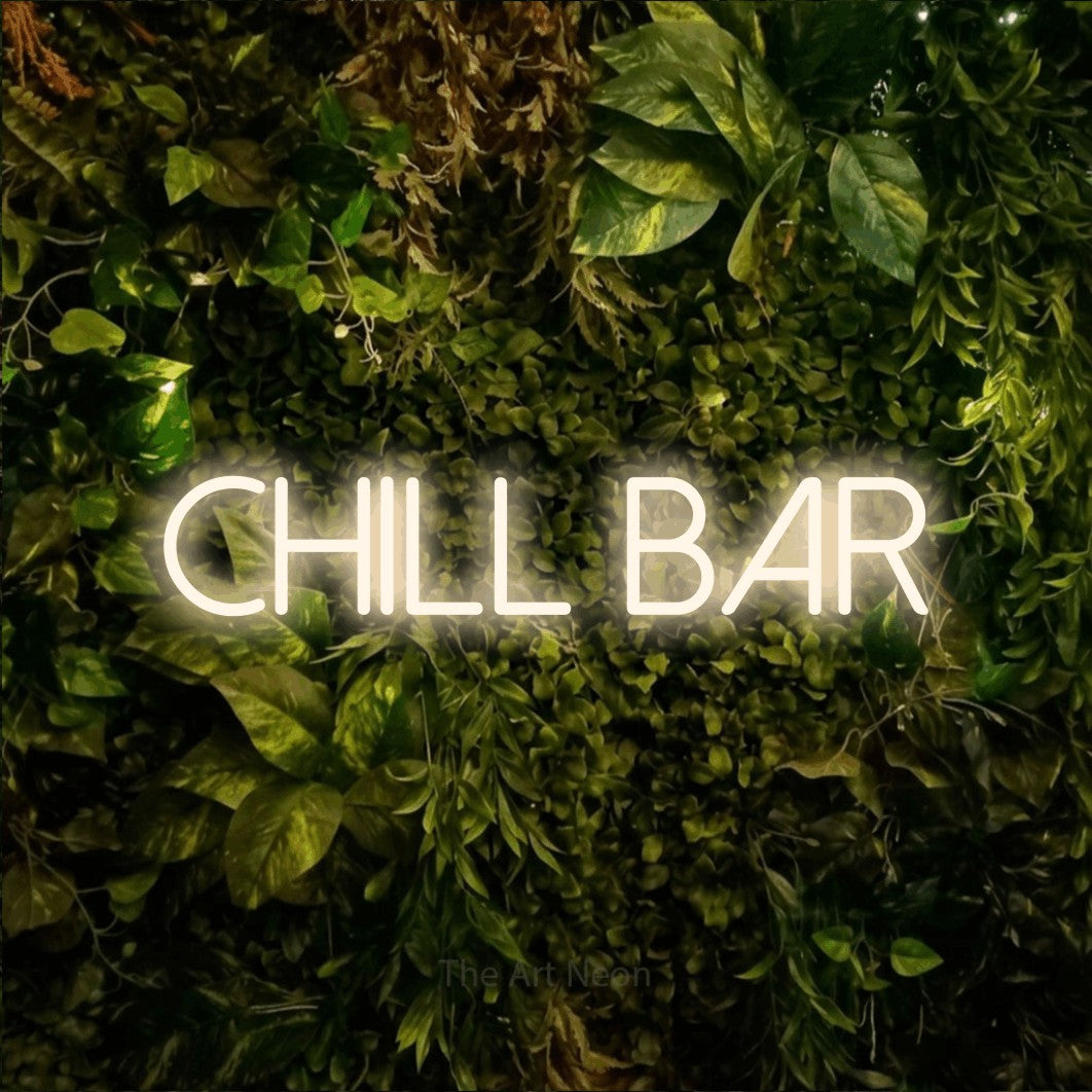 LED neon sign reading “chill bar”, arranged in a single line.