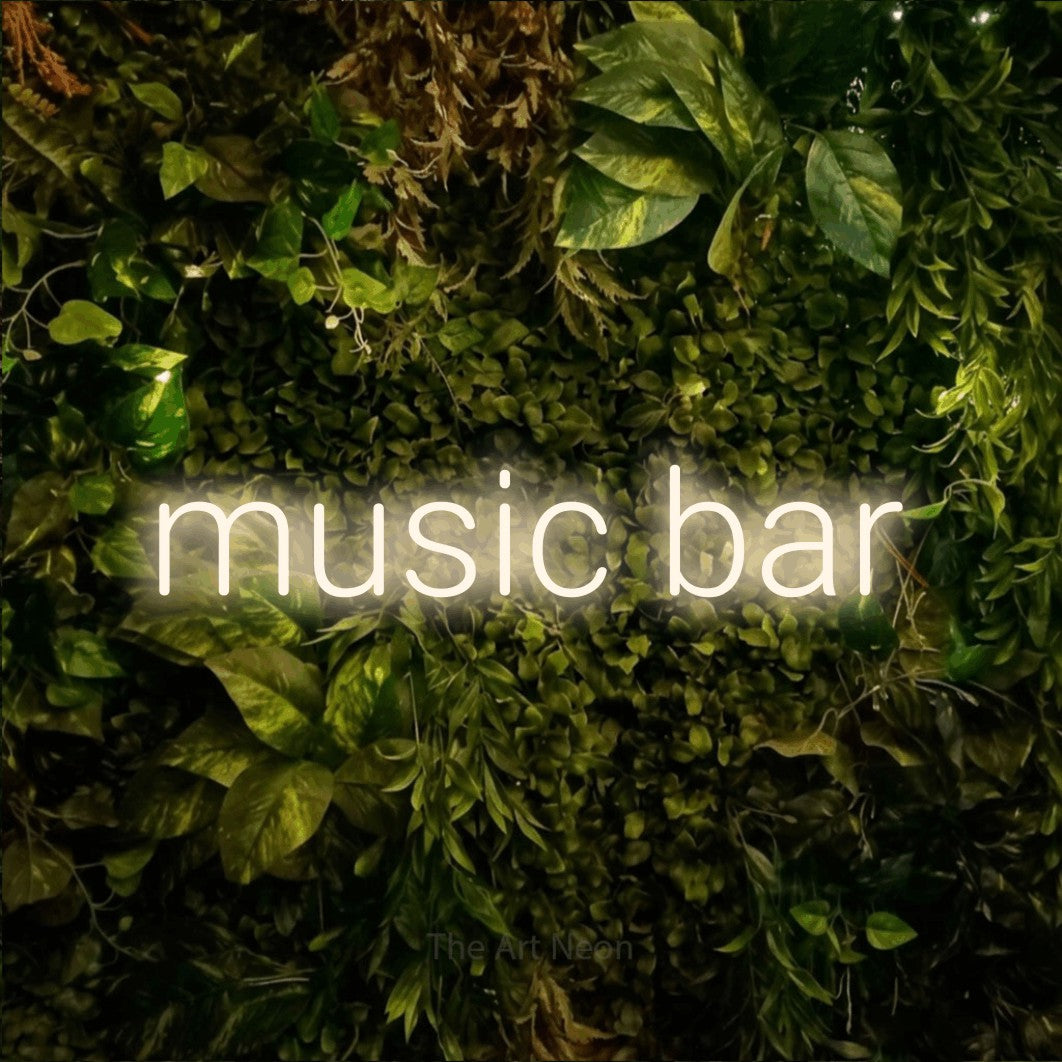 LED neon sign reading “music bar”, arranged in a single line.