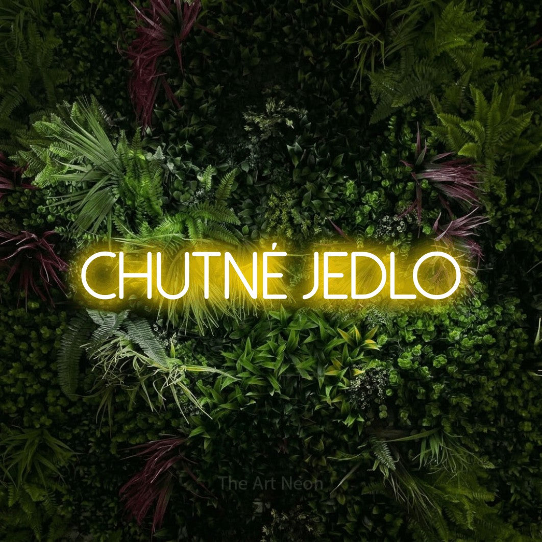 LED neon sign reading “chutné jedlo”, arranged in a single line.