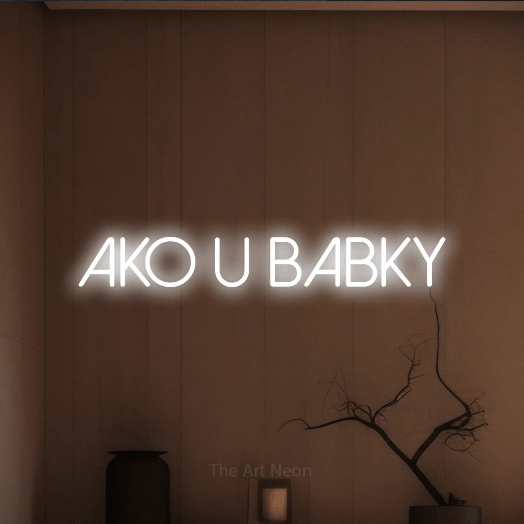 LED neon sign reading “AKO U BABKY”, arranged in a single line.