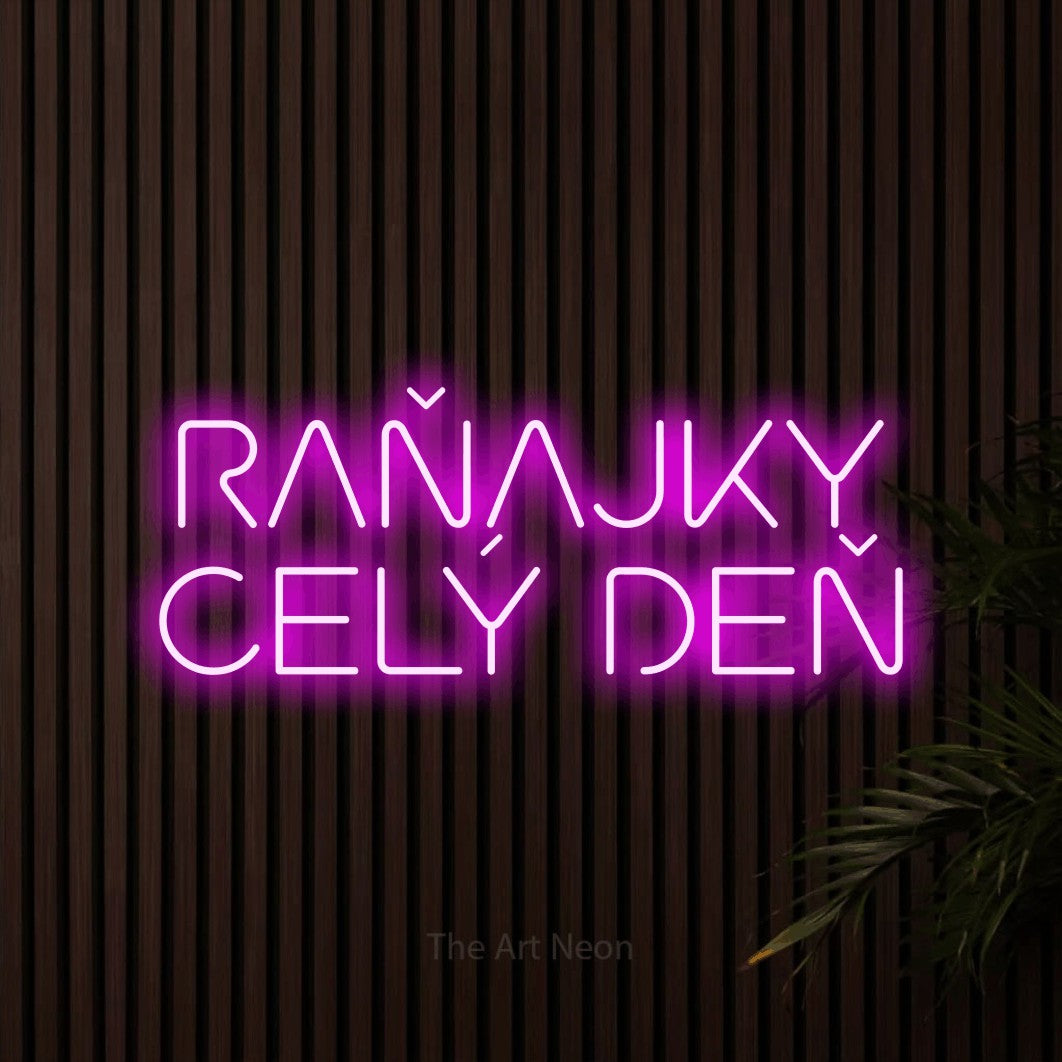 LED neon sign reading “RAŇAJKY CELÝ DEŇ”, arranged in two lines.