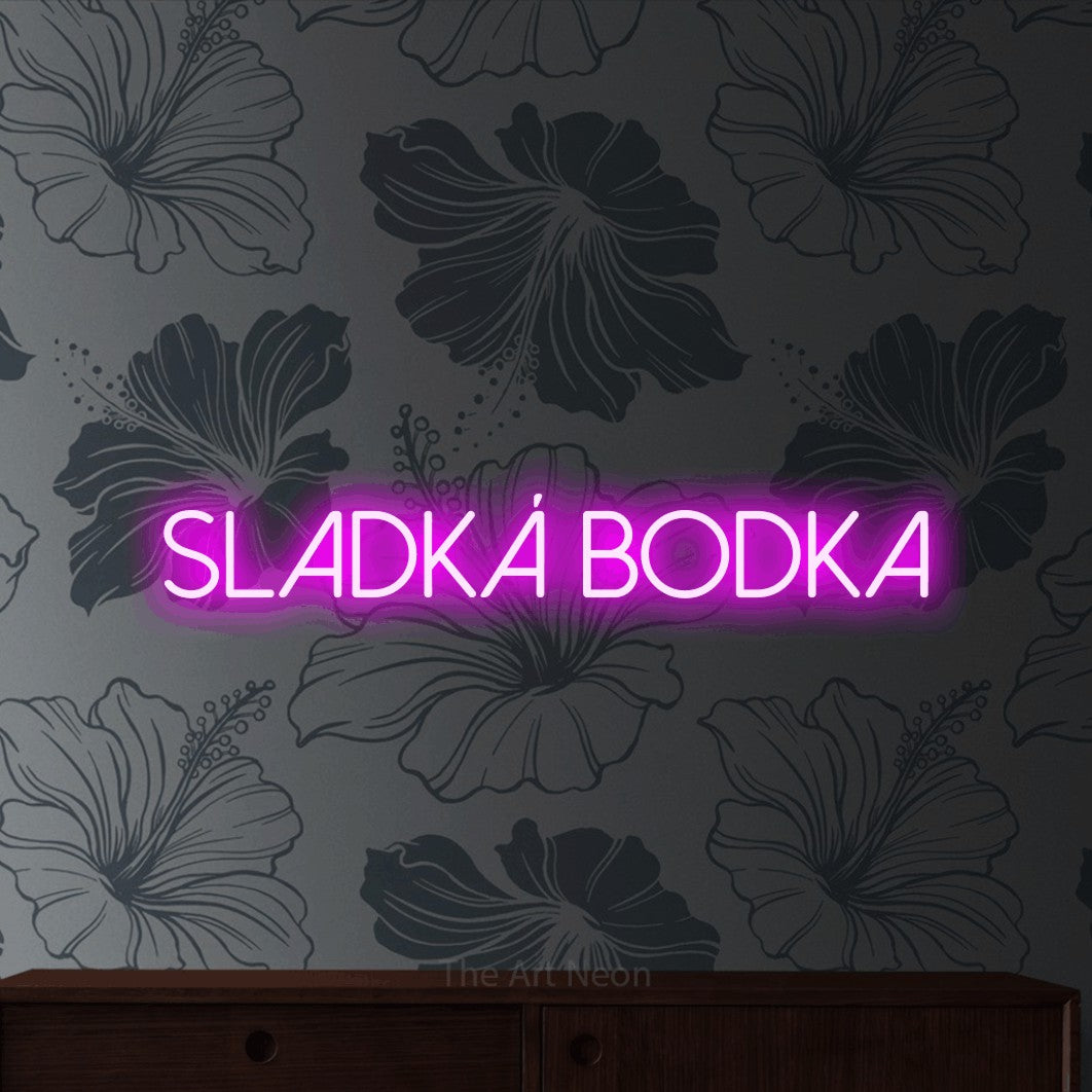 LED neon sign reading “SLADKÁ bodka”, arranged in a single line.