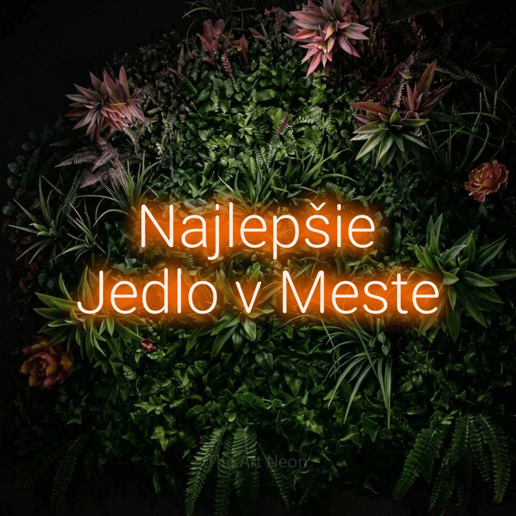 LED neon sign reading “Najlepšie Jedlo v Meste”, arranged in two lines.