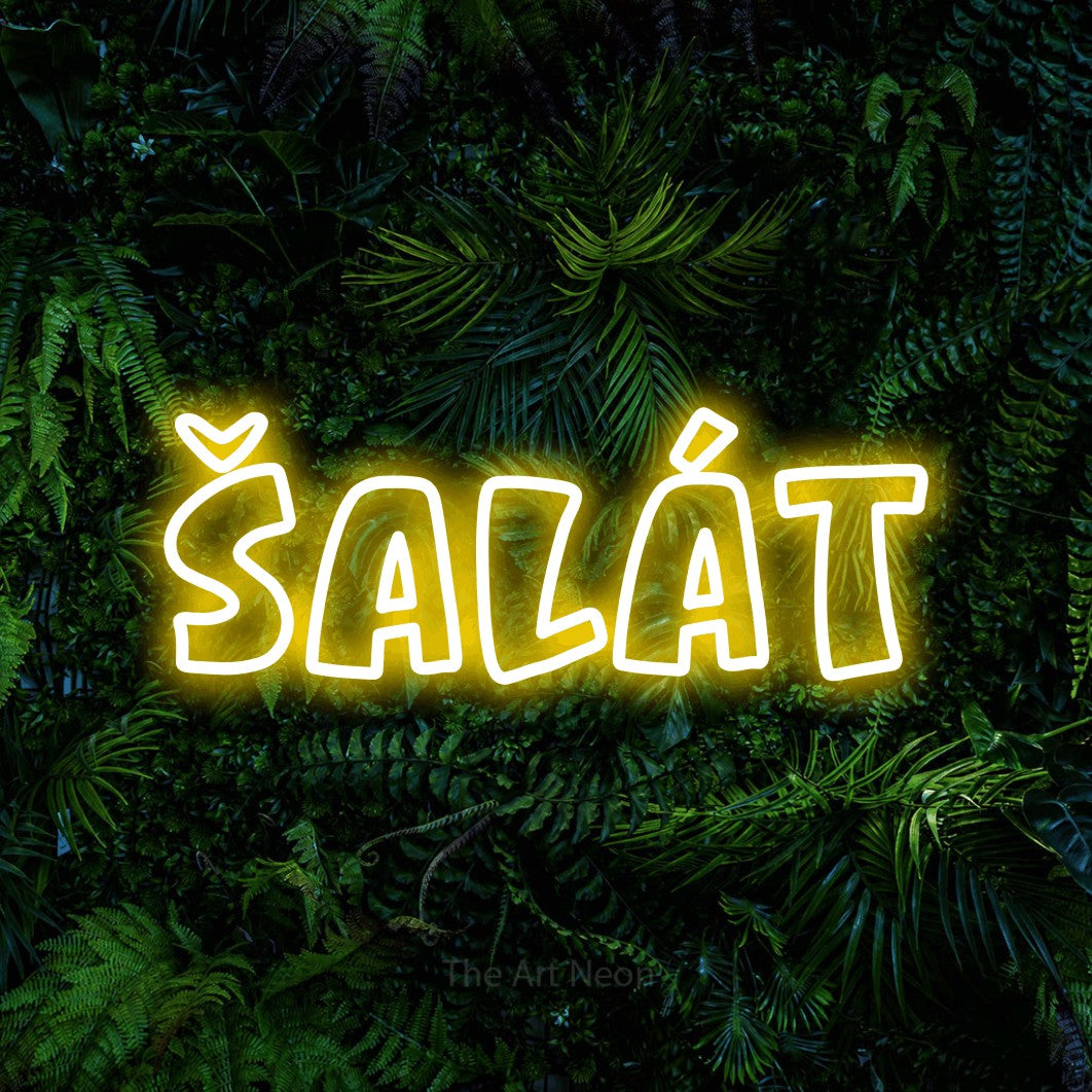 LED neon sign reading “Šalát”, arranged in a single line.