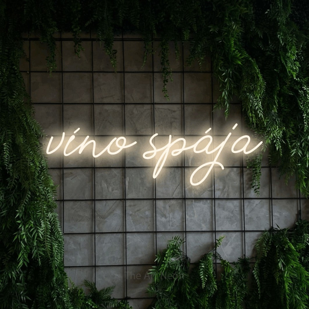 LED neon sign reading “víno spája”, arranged in a single line.