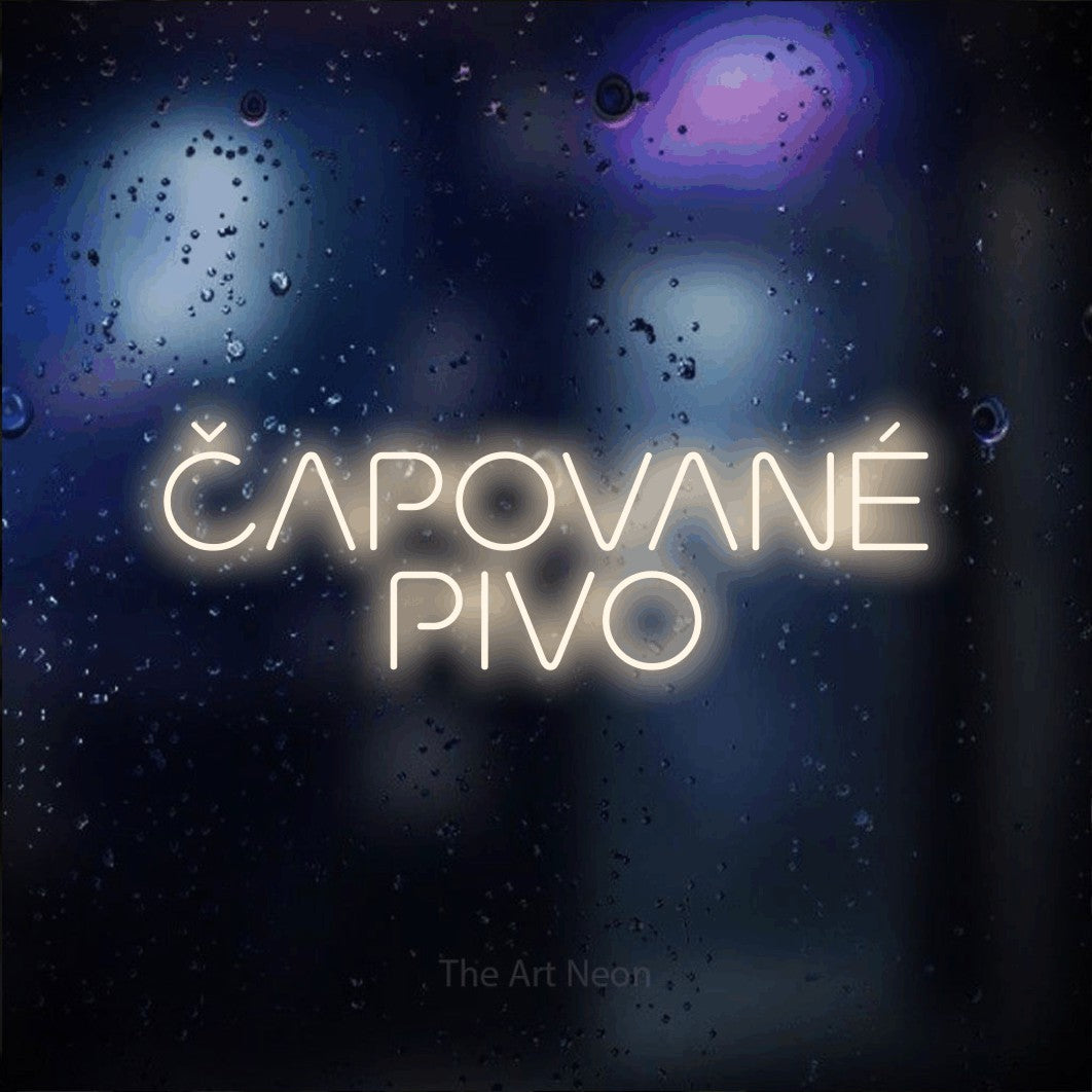 LED neon sign reading “ČAPOVANÉ PIVO”, arranged in two lines.