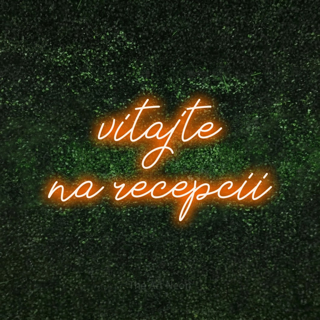 LED neon sign reading “vitajte na recepcii”, arranged in two lines.