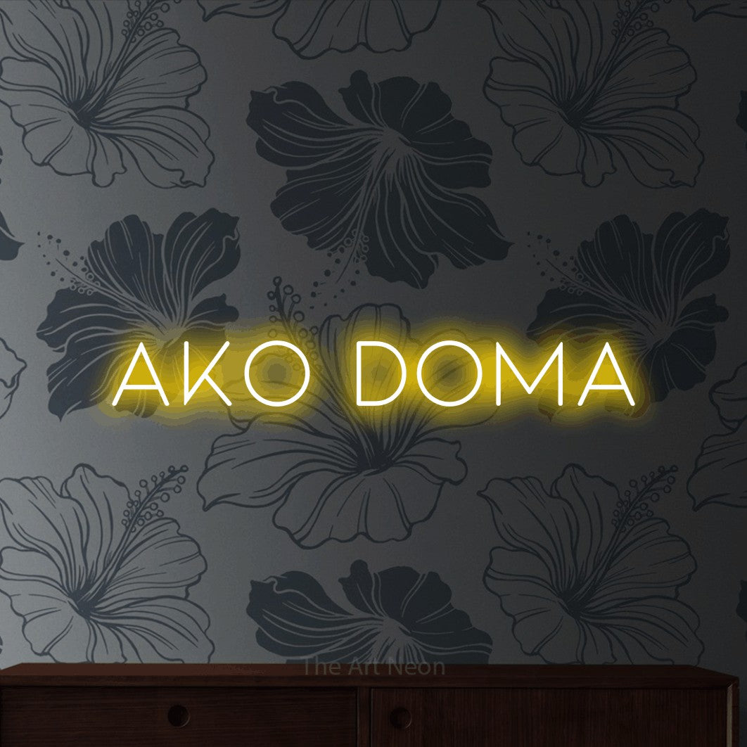 LED neon sign reading “Ako Doma”, arranged in a single line.