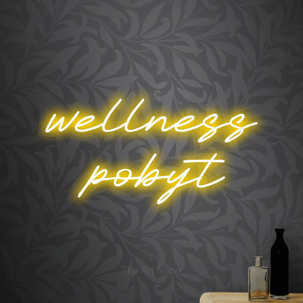 LED neon sign reading “wellness pobyt”, arranged in two lines.