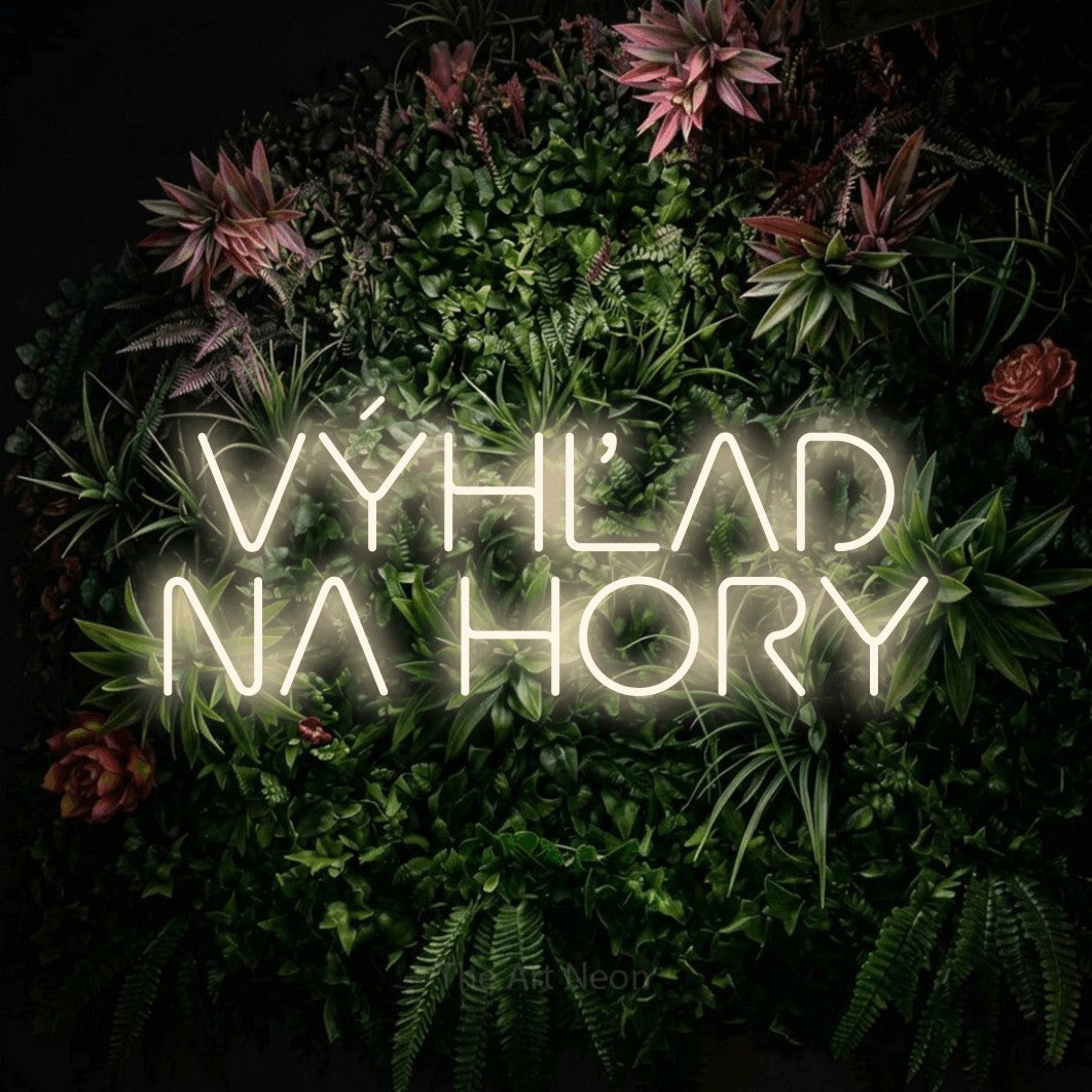 LED neon sign reading “VÝHĽAD NA HORY”, arranged in two lines.