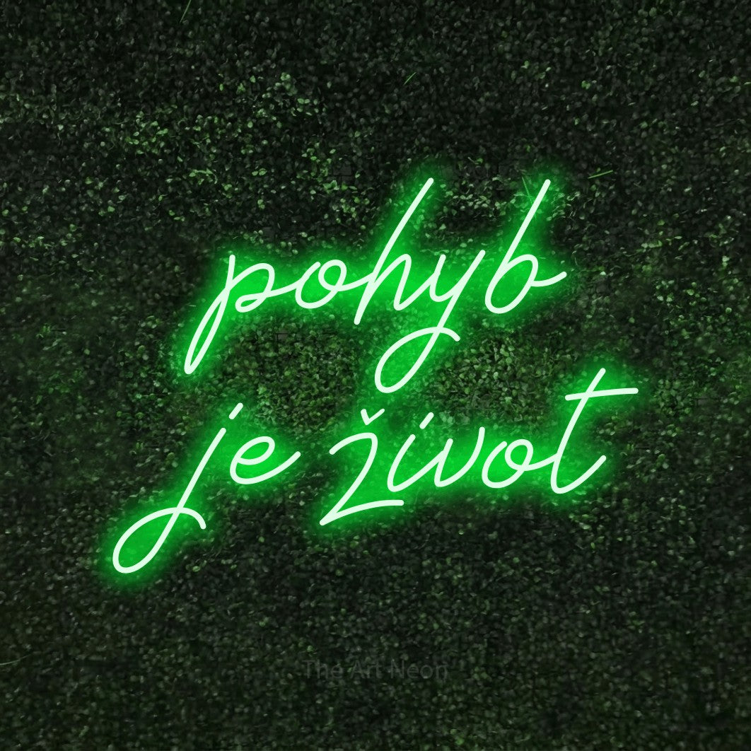 LED neon sign reading “pohyb je život”, arranged in two lines.