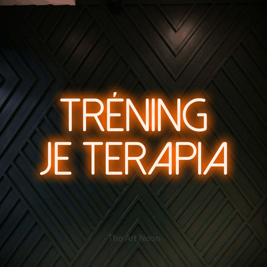 LED neon sign reading “TRÉNING JE TERAPIA”, arranged in two lines.