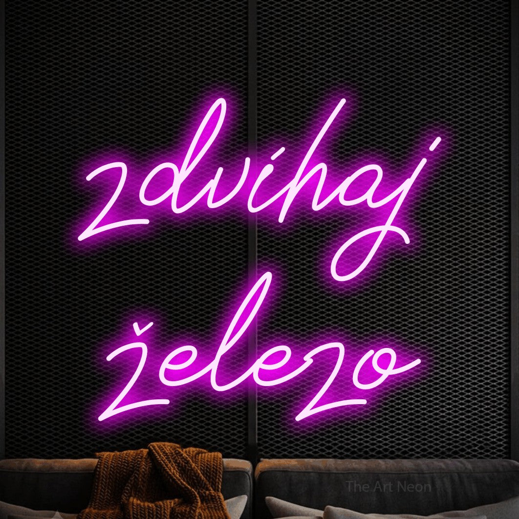 LED neon sign reading “zdvíhaj železo”, arranged in two lines.