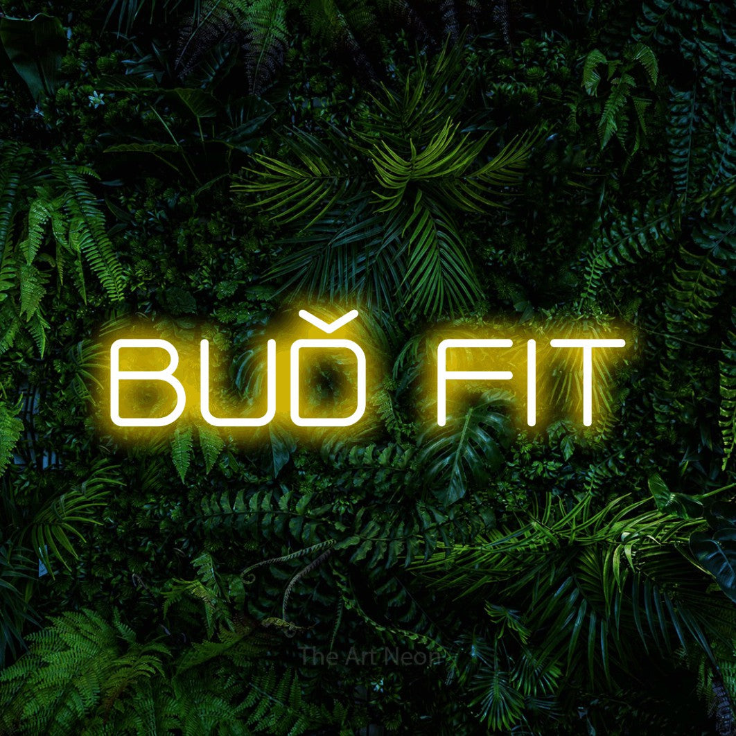 LED neon sign reading “BUĎ FIT”, arranged in a single line.