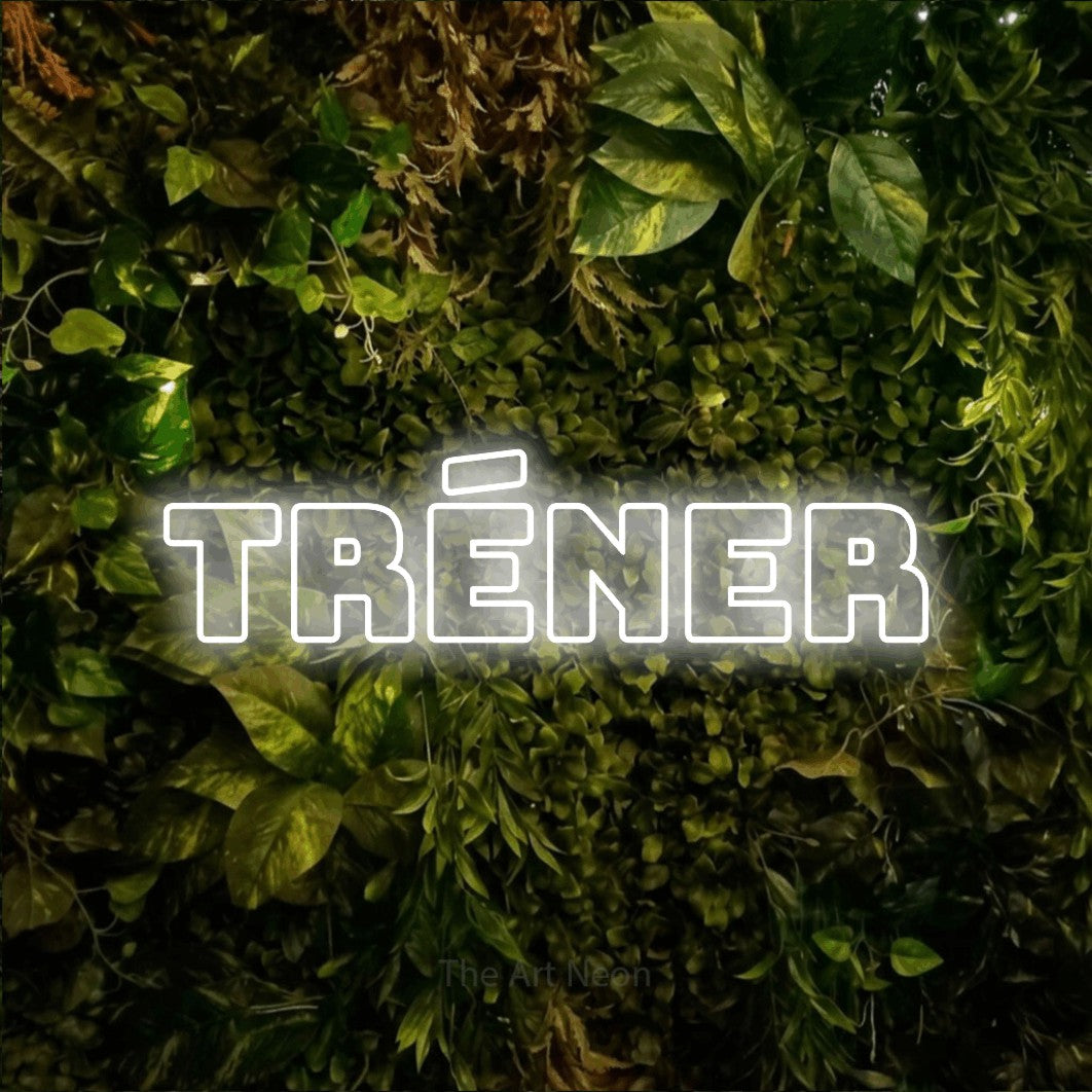 LED neon sign reading “TRÉNER”, arranged in a single line.