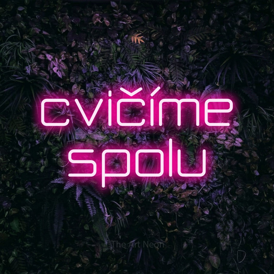 LED neon sign reading “cvičíme spolu”, arranged in two lines.