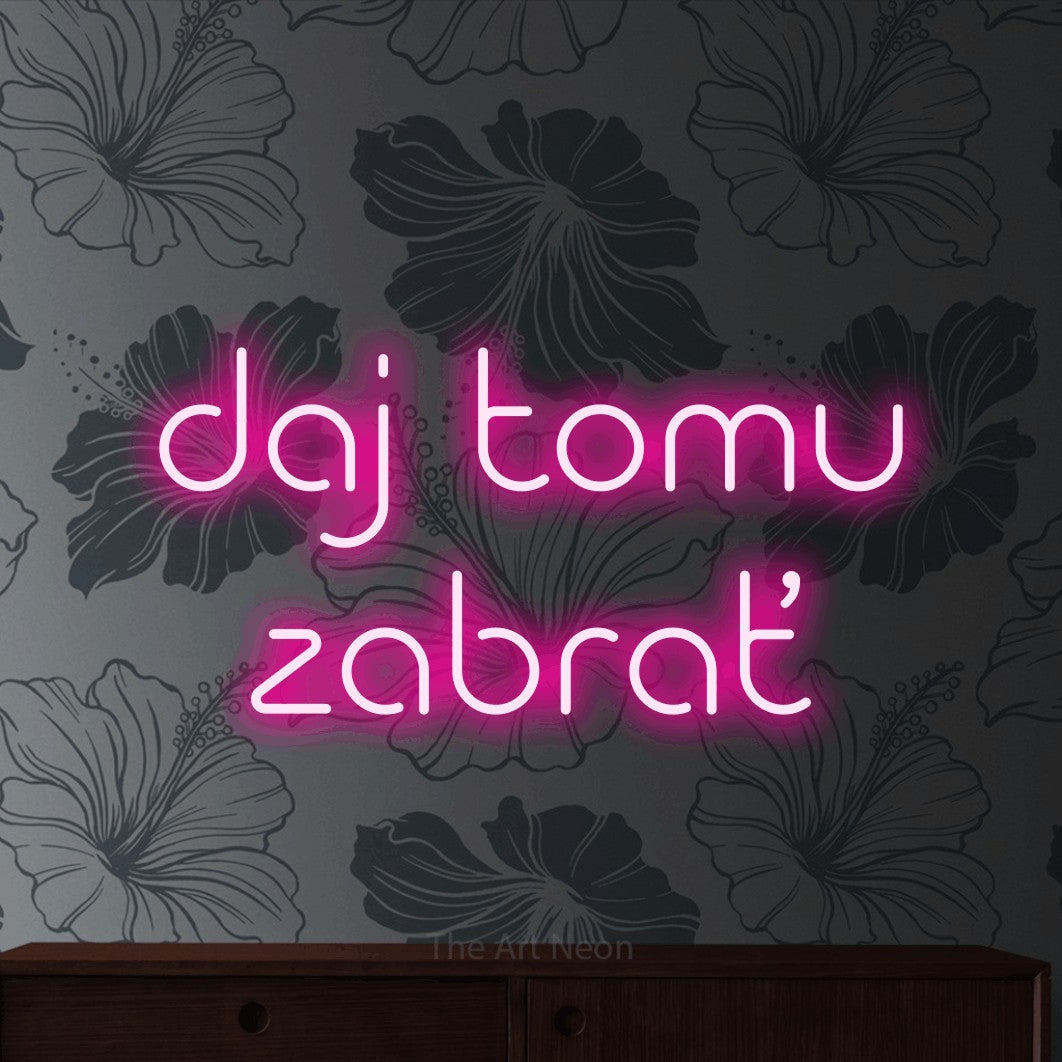 LED neon sign reading “daj tomu zabrať”, arranged in two lines.