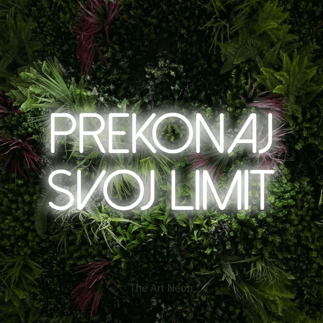 LED neon sign reading “prekonaj svoj limit”, arranged in two lines.